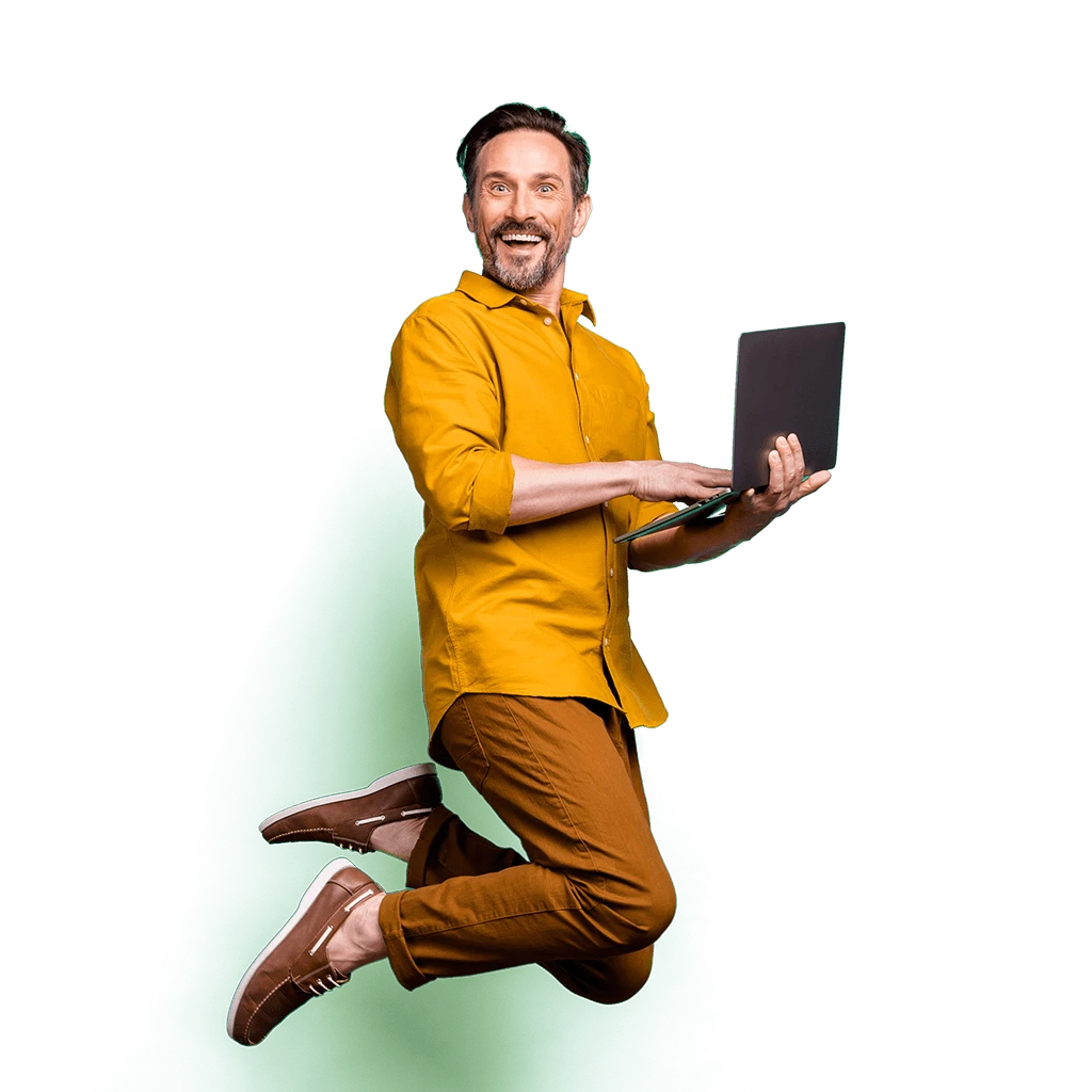 A Chumba Casino player, holding a laptop whilst jumping happily.